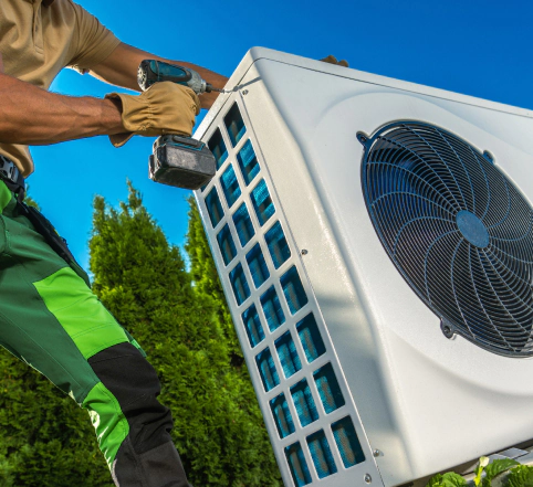 hvac technician opening the cover of heat pump